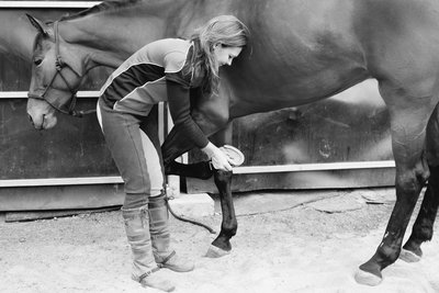 Deb checking horse shoe
